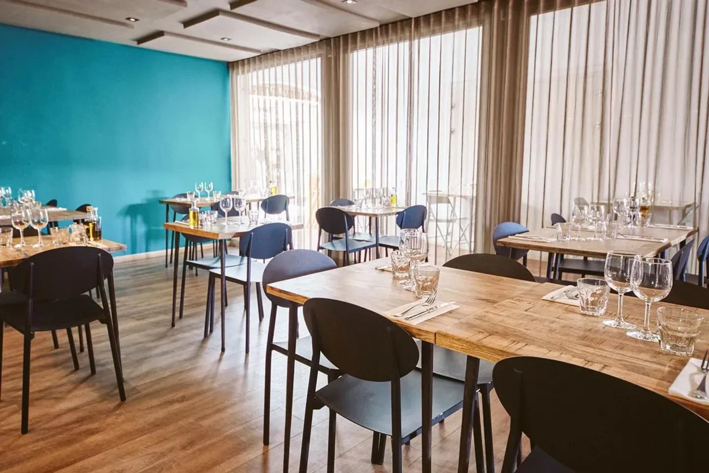Interior of Fish Corner restaurant in St. Barts, featuring dining tables and chairs.