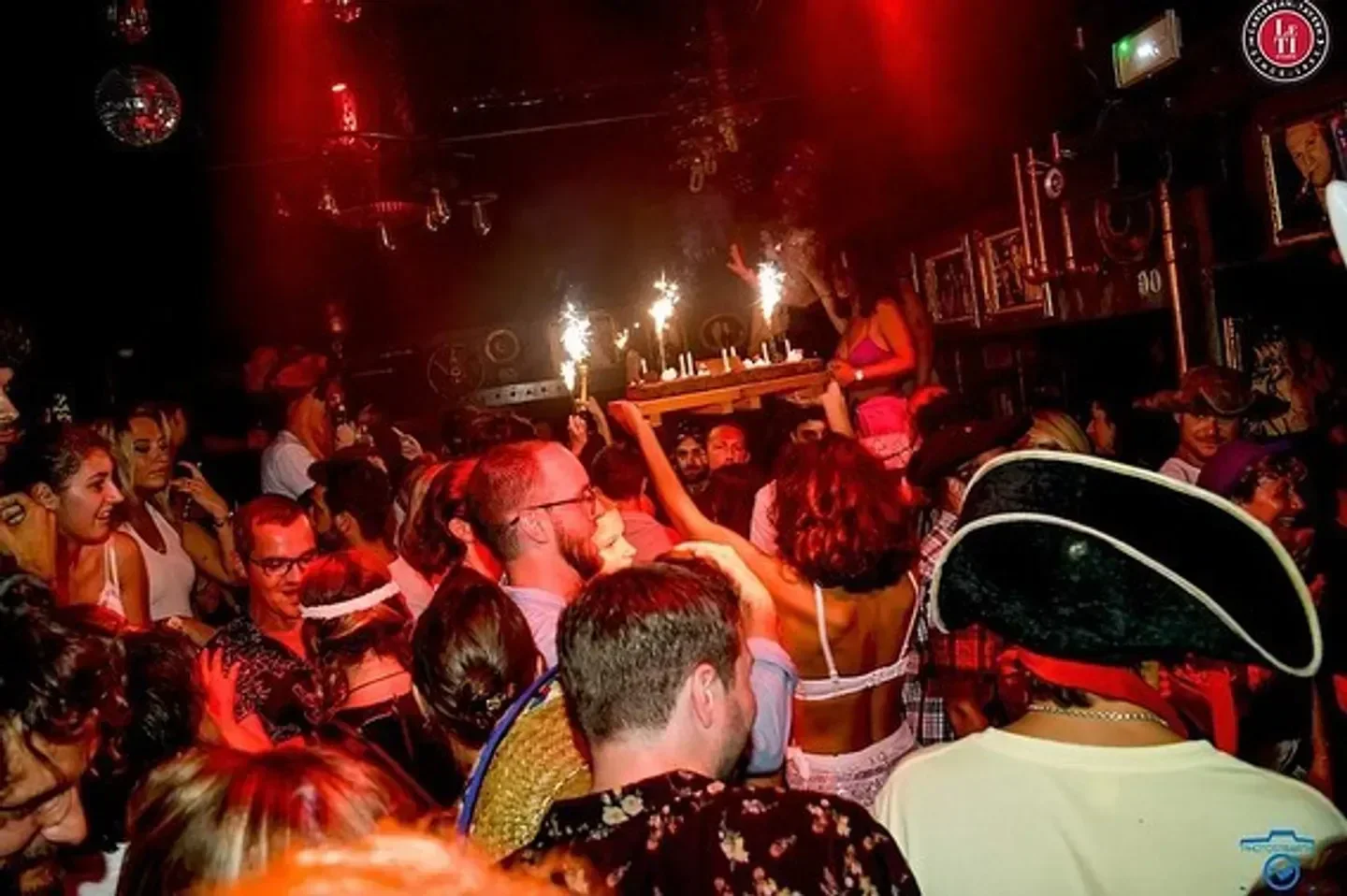 Le Ti nightclub in St. Barts with a lively crowd, celebrating with sparklers.